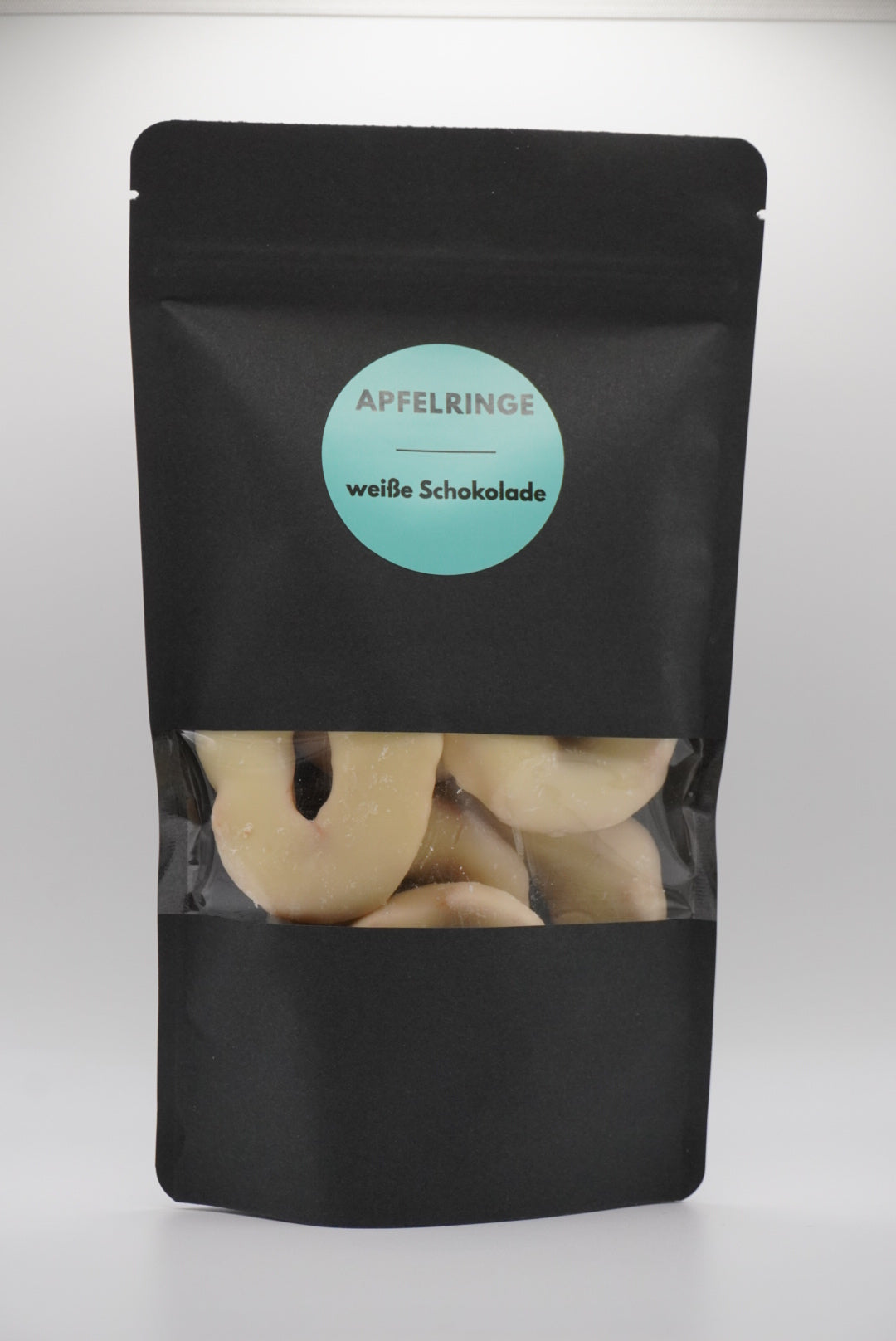 Apfelringe in weißer Schokolade