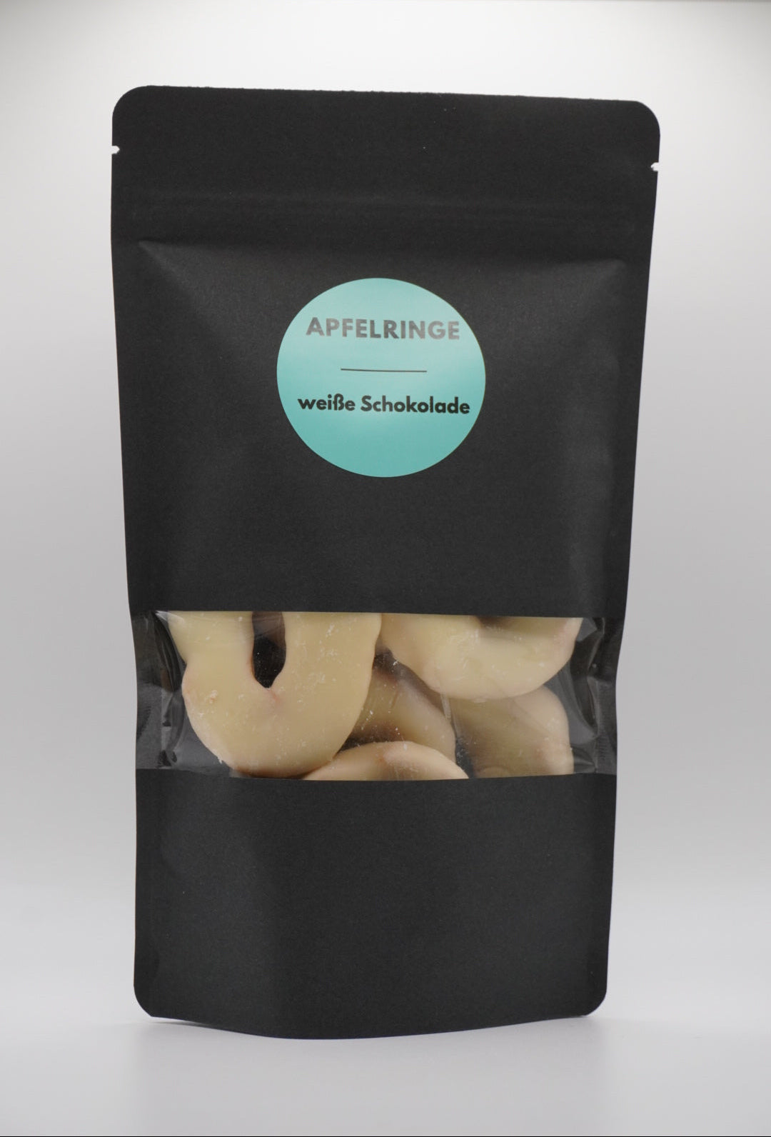 Apfelringe in weißer Schokolade